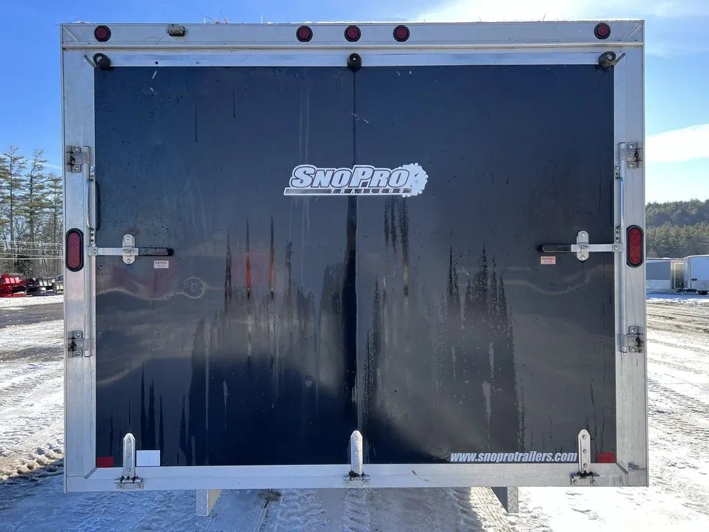 2008 Sno Pro 4-Place Snowmobile Trailer – Black Aluminum – Straight-on view of the closed rear double doors