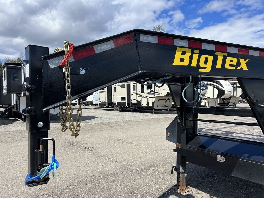 2023 Big Tex 40 ft Equipment Trailer – Slide-Out Ramps – Close-up of the gooseneck coupler with safety chains and branding visible