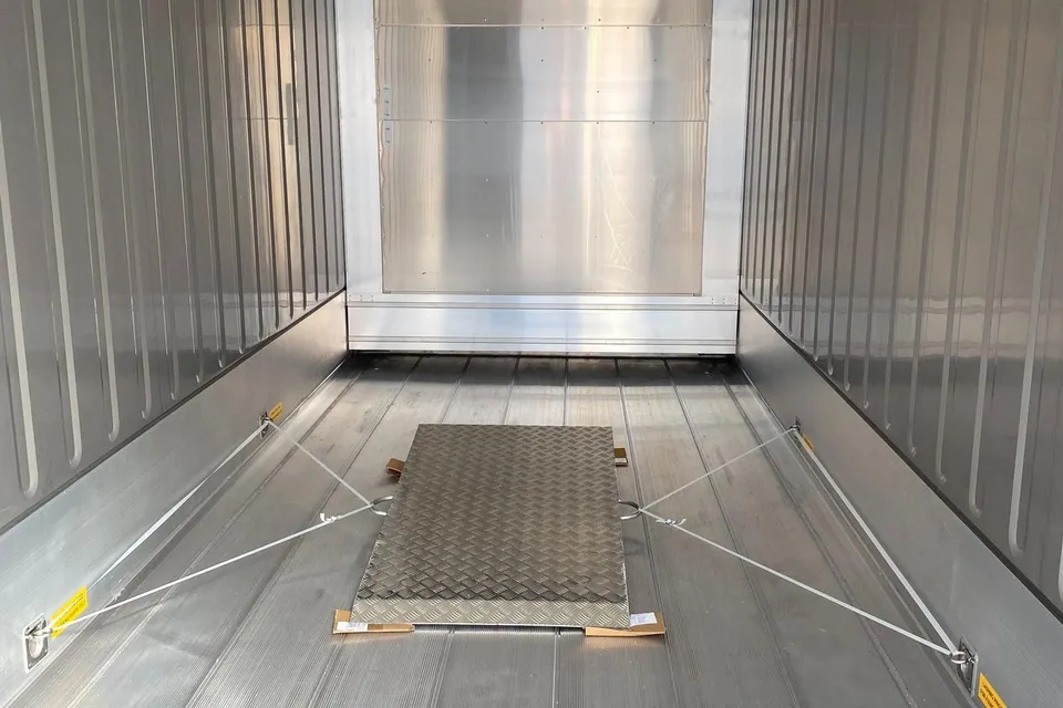30ft Refrigerated Container – Stationary Cold Storage – Empty refrigerated container interior with secured metal floor panel