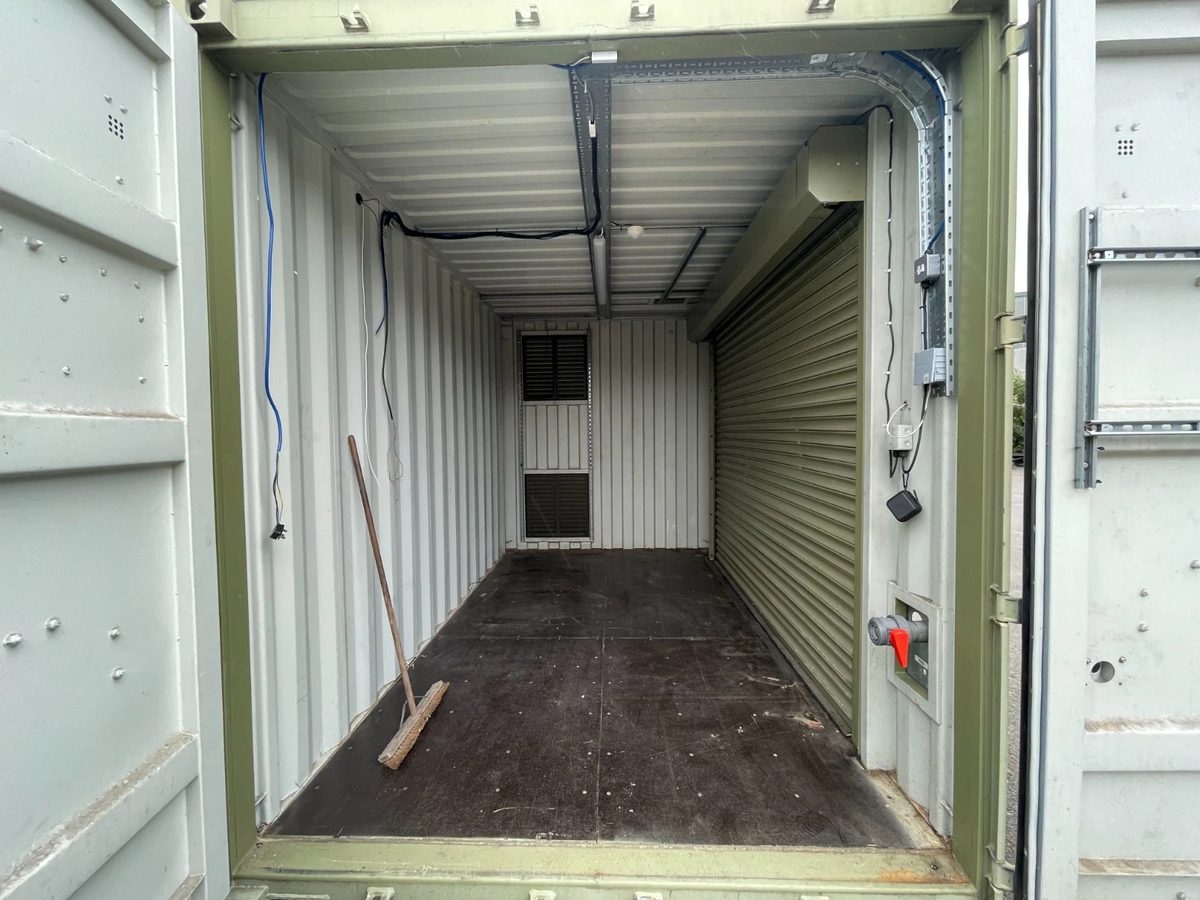 13ft Used Shipping Container – Lock Box Storage – Empty container interior with side roller shutter and exposed wiring