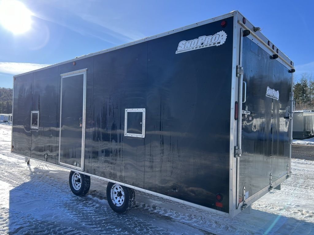 2008 Sno Pro 4-Place Snowmobile Trailer – Black Aluminum – Rear three-quarter view showing the black side panels and silver trim
