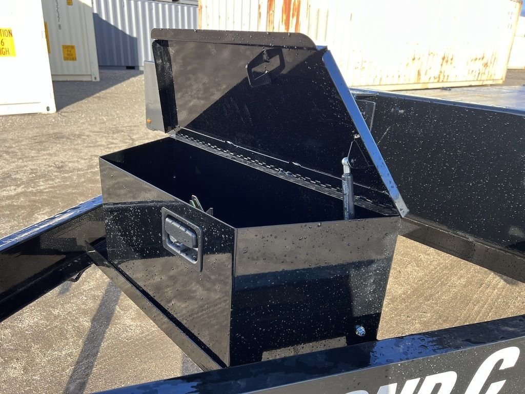 2024 Diamond C 22 ft Deckover Trailer – Slide-In Ramps – Close-up of the black metal toolbox in an open position showing interior