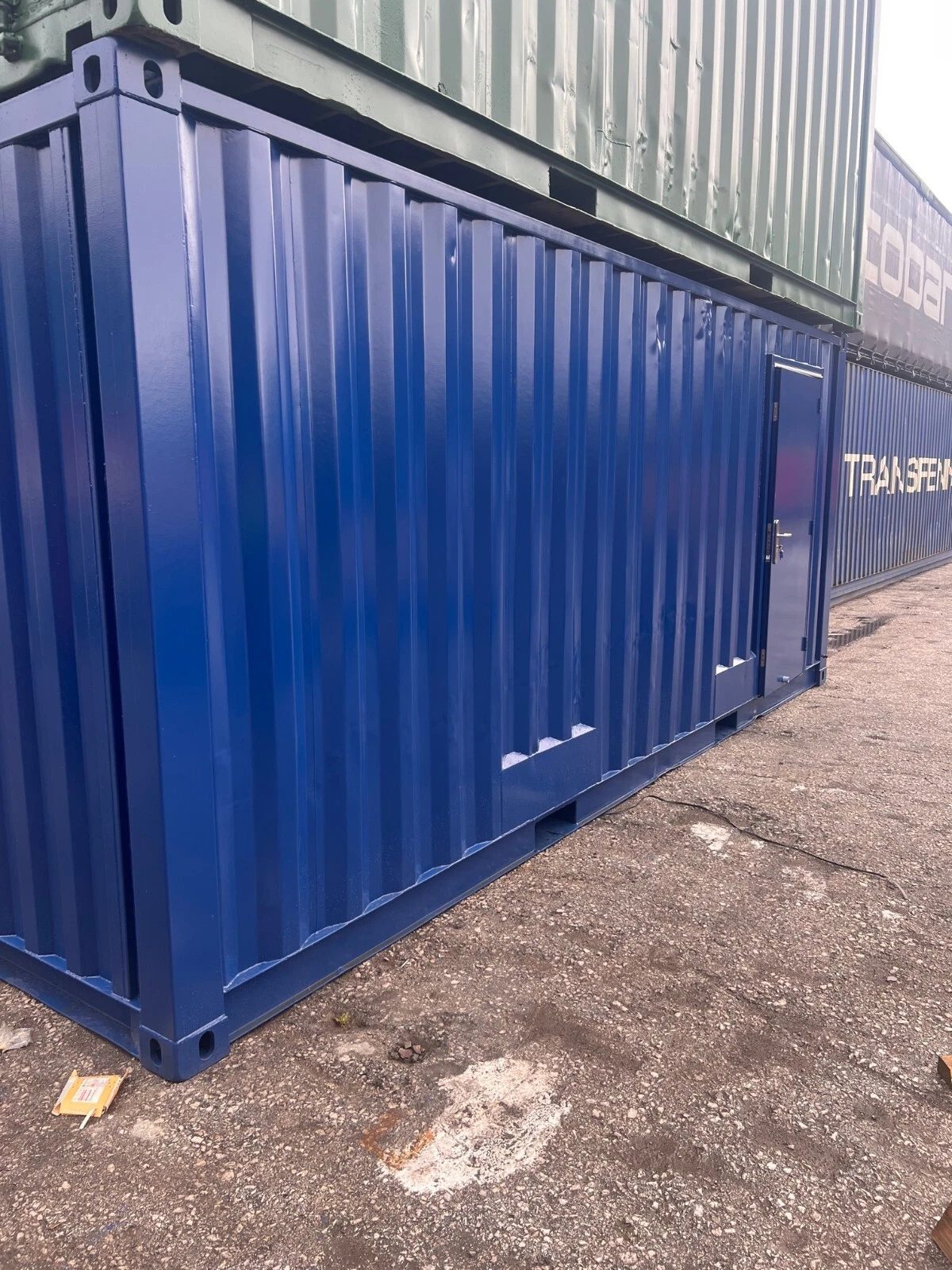 20ft Refurbished Container Toilet Block – Separate Compartments – blue corrugated container exterior with closed personnel door