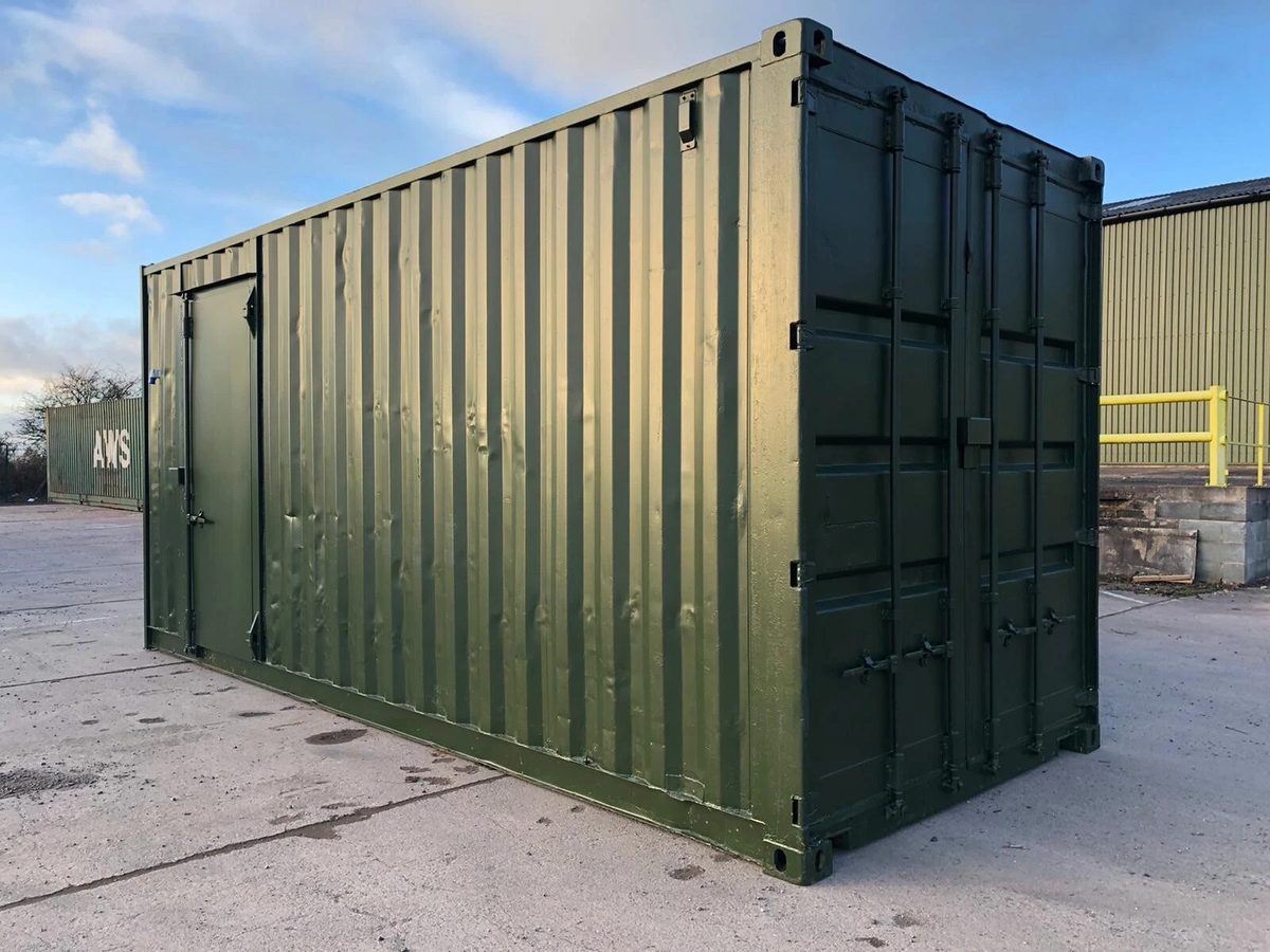 20ft High Cube Storage Container – Lighting and Shelving – Three-quarter exterior with closed cargo doors and side personnel door