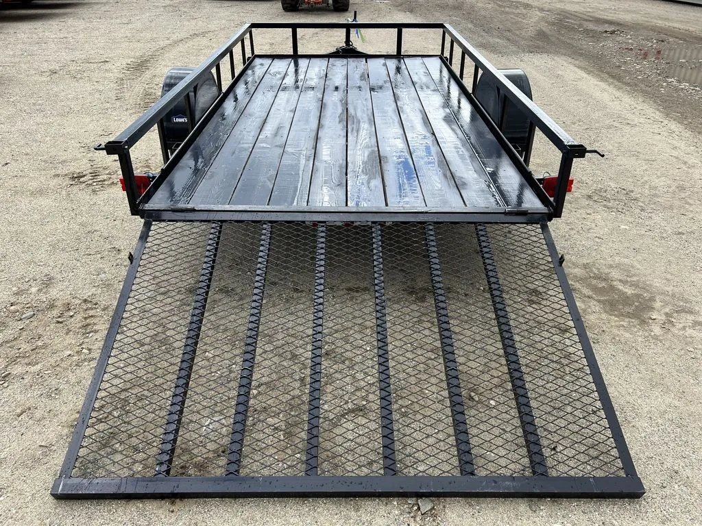 2024 Carry-On 12 ft Utility Trailer – Rear Ramp Gate – High angle view looking into the trailer bed showing the wood floor planks