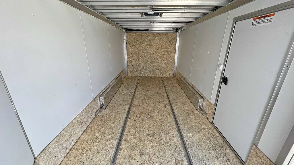 2023 High Country 14 ft Trailer – Blue, Drive-Through – View looking towards the front of the empty trailer interior with wooden floors