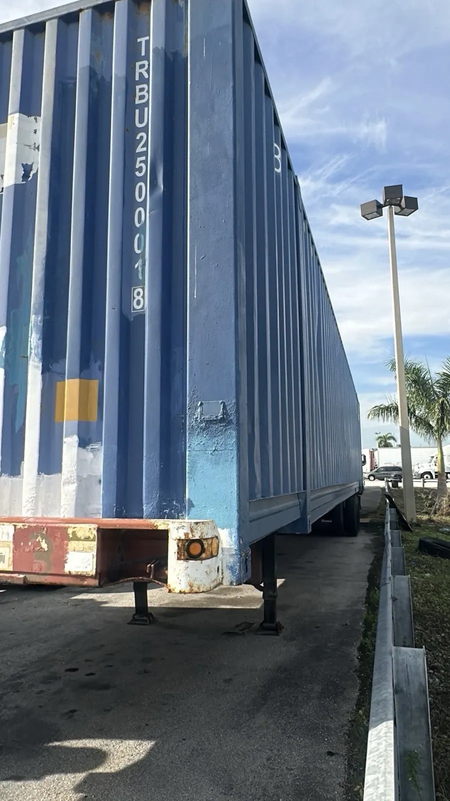 53ft High Cube Shipping Container – Used, Cargo Worthy – cropped exterior corner and long side of weathered blue container