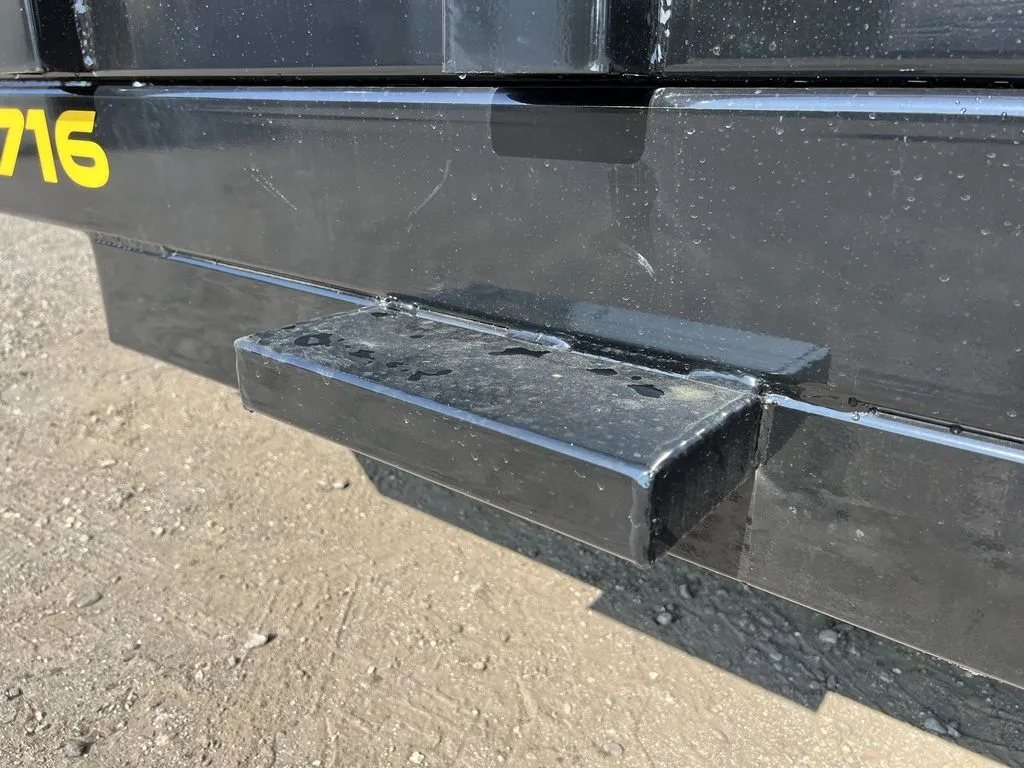 2024 Griffin Trailers 16 ft Dump Trailer – Telescopic – A close-up of a side step welded onto the trailer frame