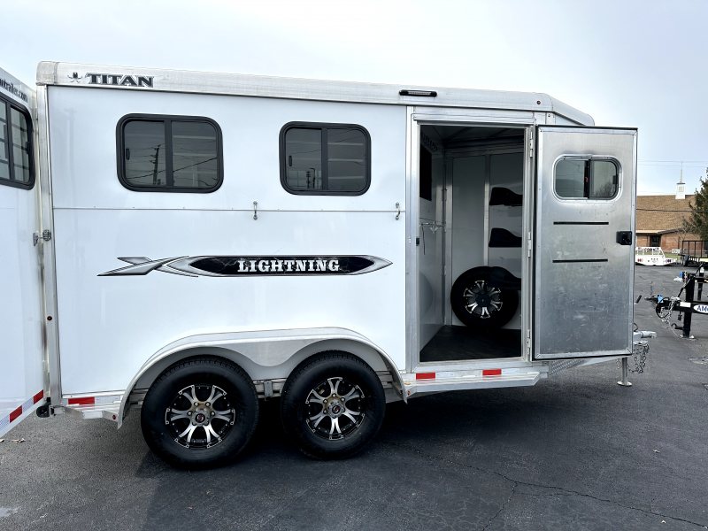 2021 Titan 2 Horse Bumper Pull Trailer – White, Slant Load – Open side access door showing interior storage and spare tire