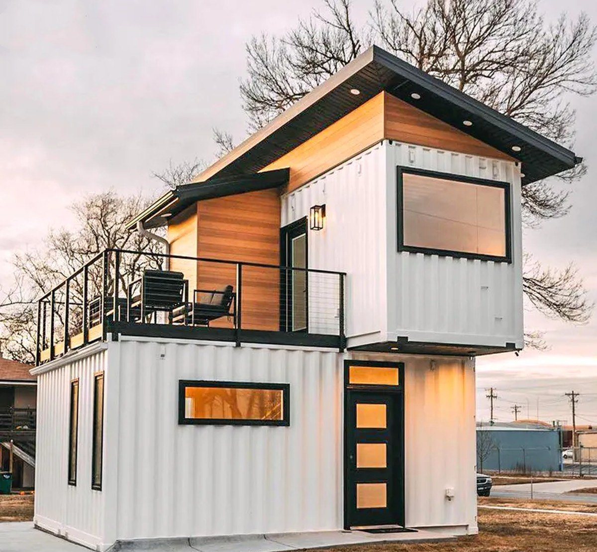 3-Bedroom Duplex Container Home – Rooftop Deck – White steel and cedar duplex with a private rooftop deck over the ground-floor module