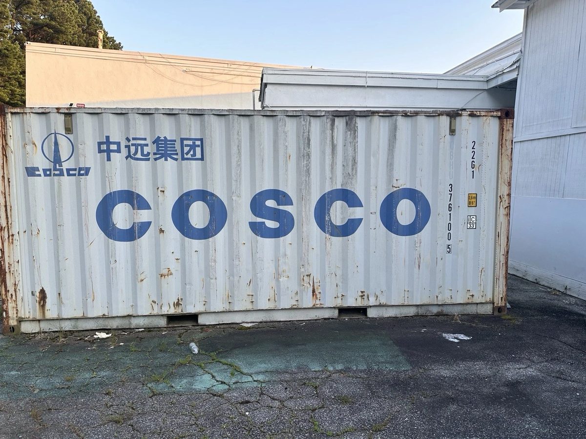 20ft Used Shipping Container – Lockable Storage – side view of weathered shipping container with rust patches
