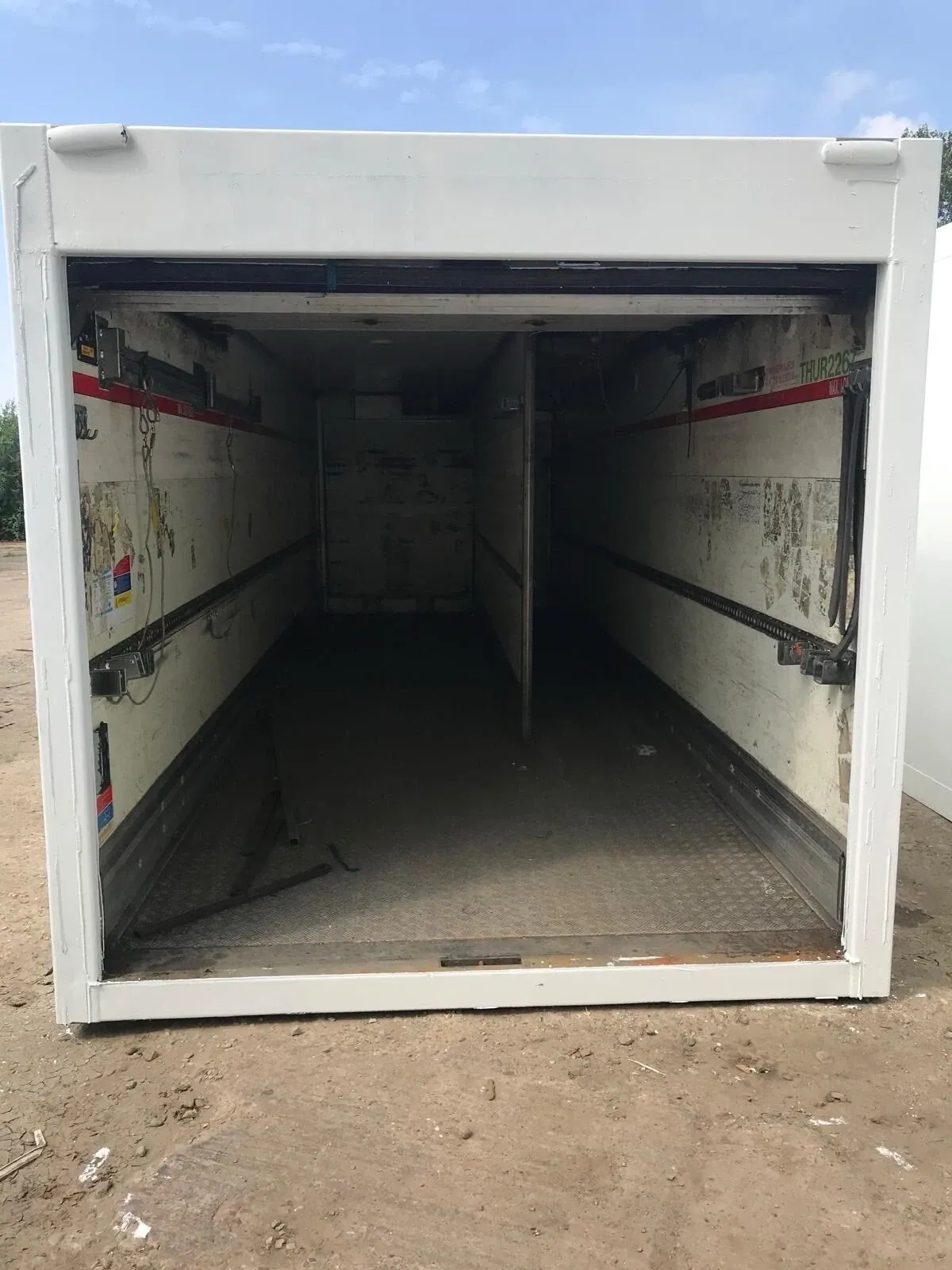 27ft–45ft Used Refrigerated Containers – Chiller & Freezer – open refrigerated container with worn walls and metal floor