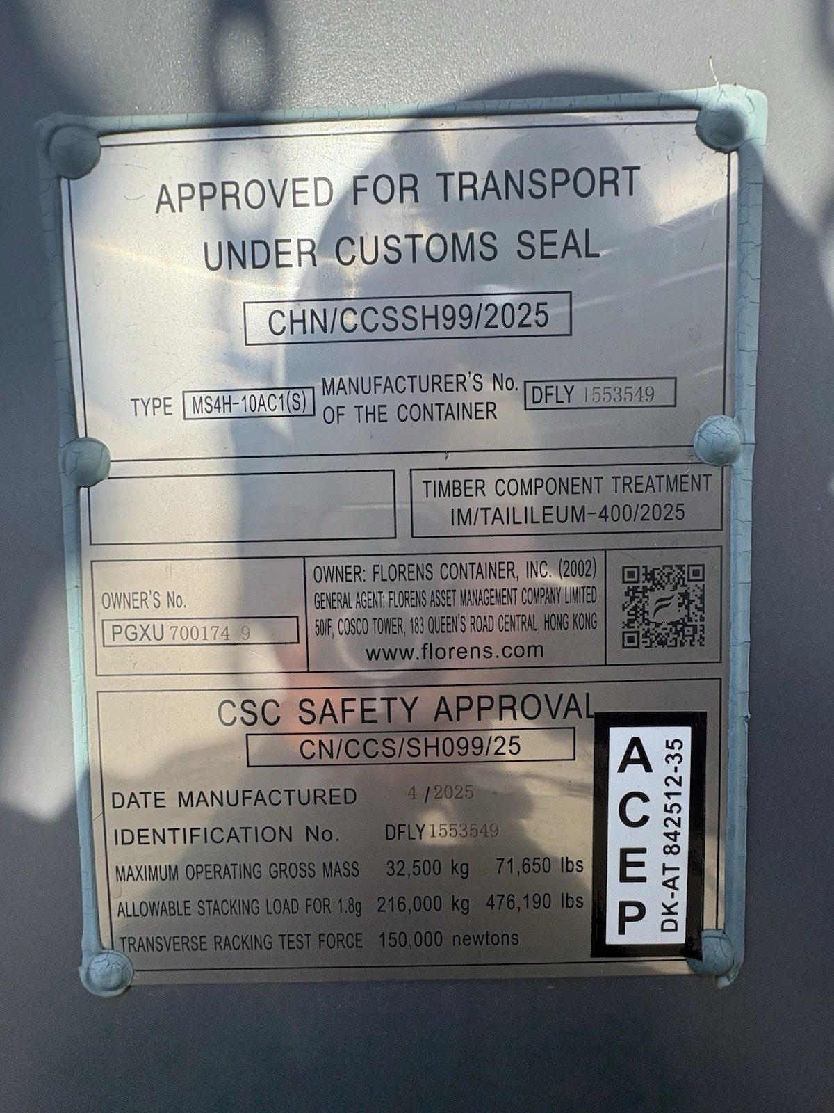 40ft High Cube Shipping Container – New / One-Trip – Close-up of container safety approval plate showing identification numbers and weight limits