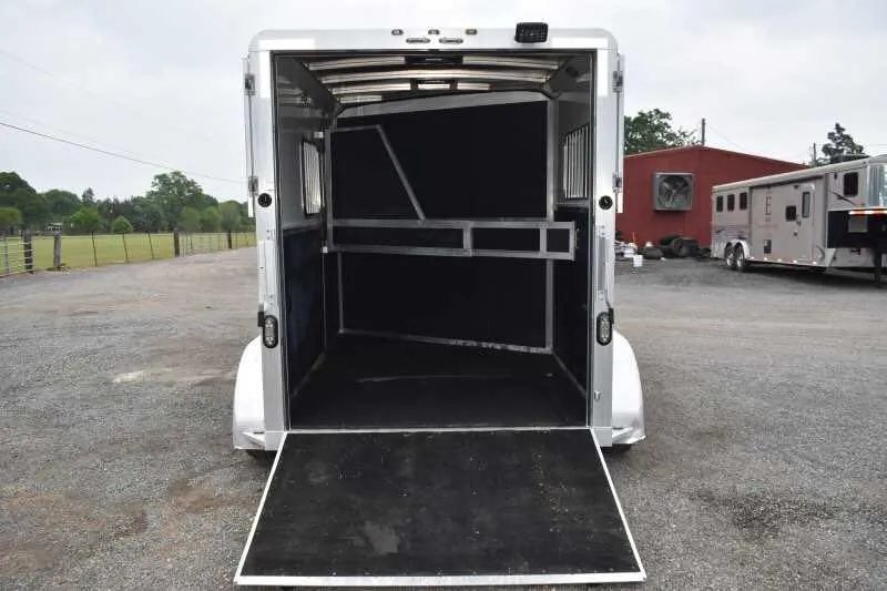 2013 Shadow 2HSL 2 Horse Trailer – Aluminum, Dressing Room – Rear view of the horse trailer with the loading ramp lowered to the ground