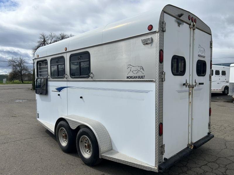 2000 Morgan Built 3 Horse Trailer – Bumper Pull – A three-quarter exterior view of the horse trailer from the rear left side