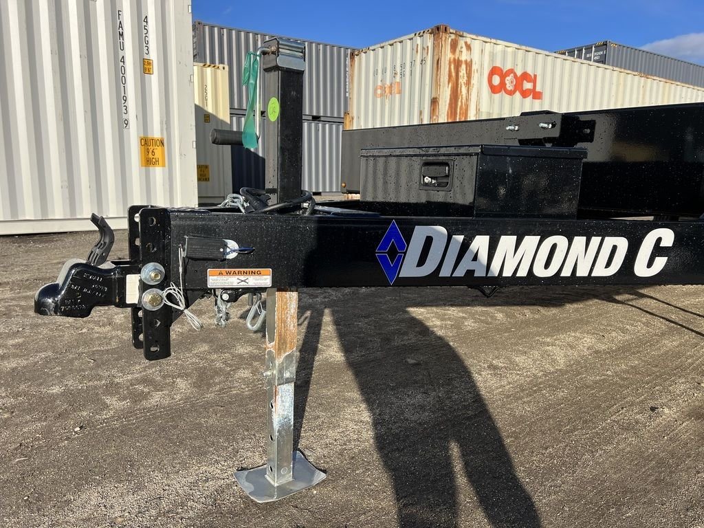 2024 Diamond C 22 ft Deckover Trailer – Slide-In Ramps – Close-up of the trailer coupler, jack, and front tongue assembly