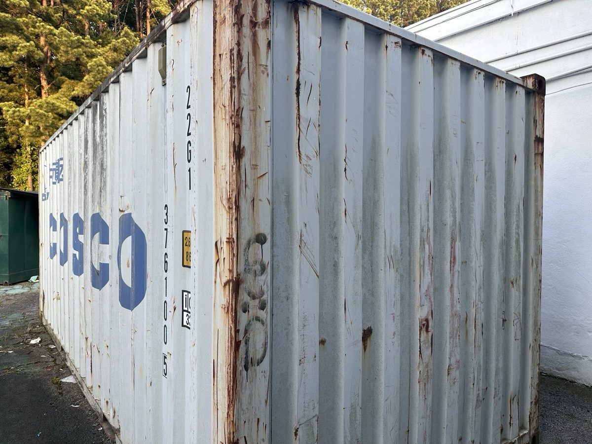 20ft Used Shipping Container – Lockable Storage – angled exterior view of weathered container with rust streaks