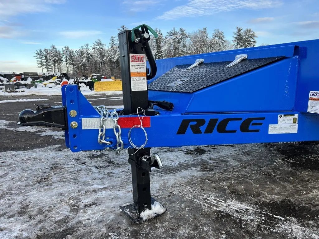 2024 Rice Trailers 20 ft Tilt Trailer – Spare Mount – Side view of the trailer tongue showing the adjustable coupler, jack, and chains