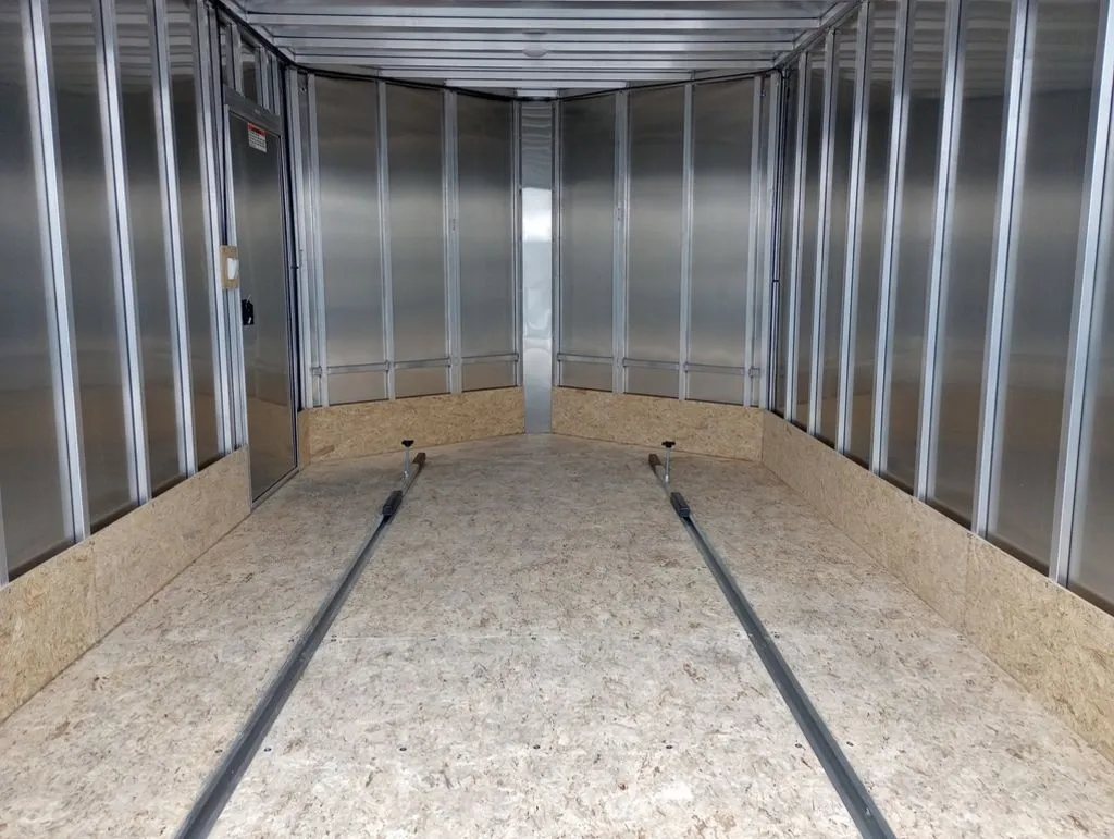 2024 Mission Trailers 12 ft Powersports – Side X Side – Wide view of the interior showing the floor tracks and metal construction