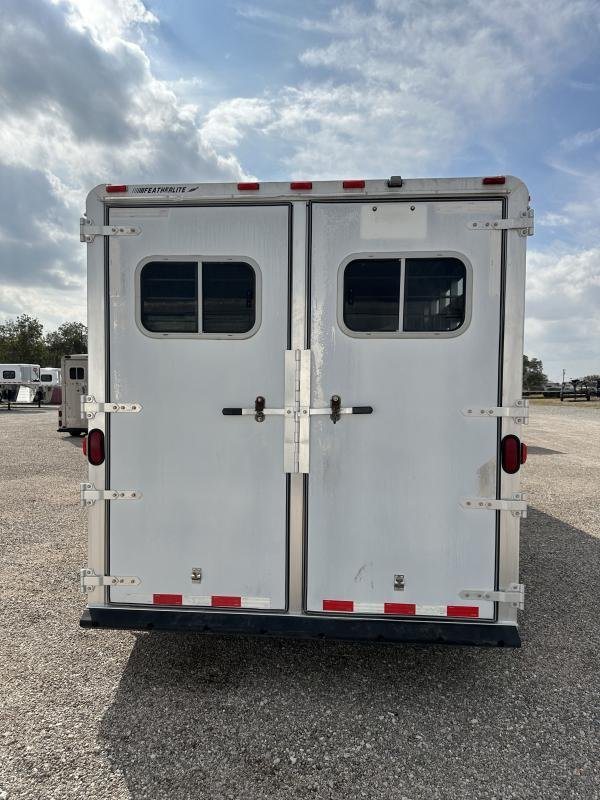 2000 Featherlite 3 Horse Gooseneck – Dressing Room – Direct rear view of the closed double doors of the aluminum horse trailer