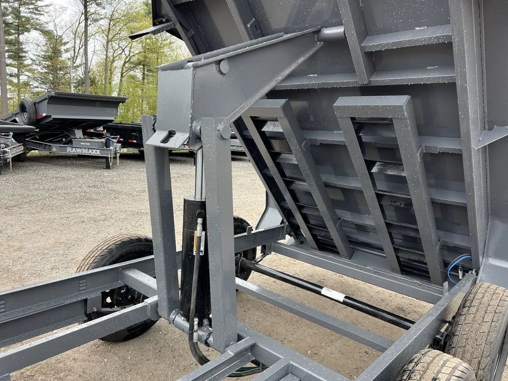 2024 RawMaxx 10 ft Dump Trailer – Shadow Grey – Detailed view of the hydraulic lift cylinder and under-bed support structure