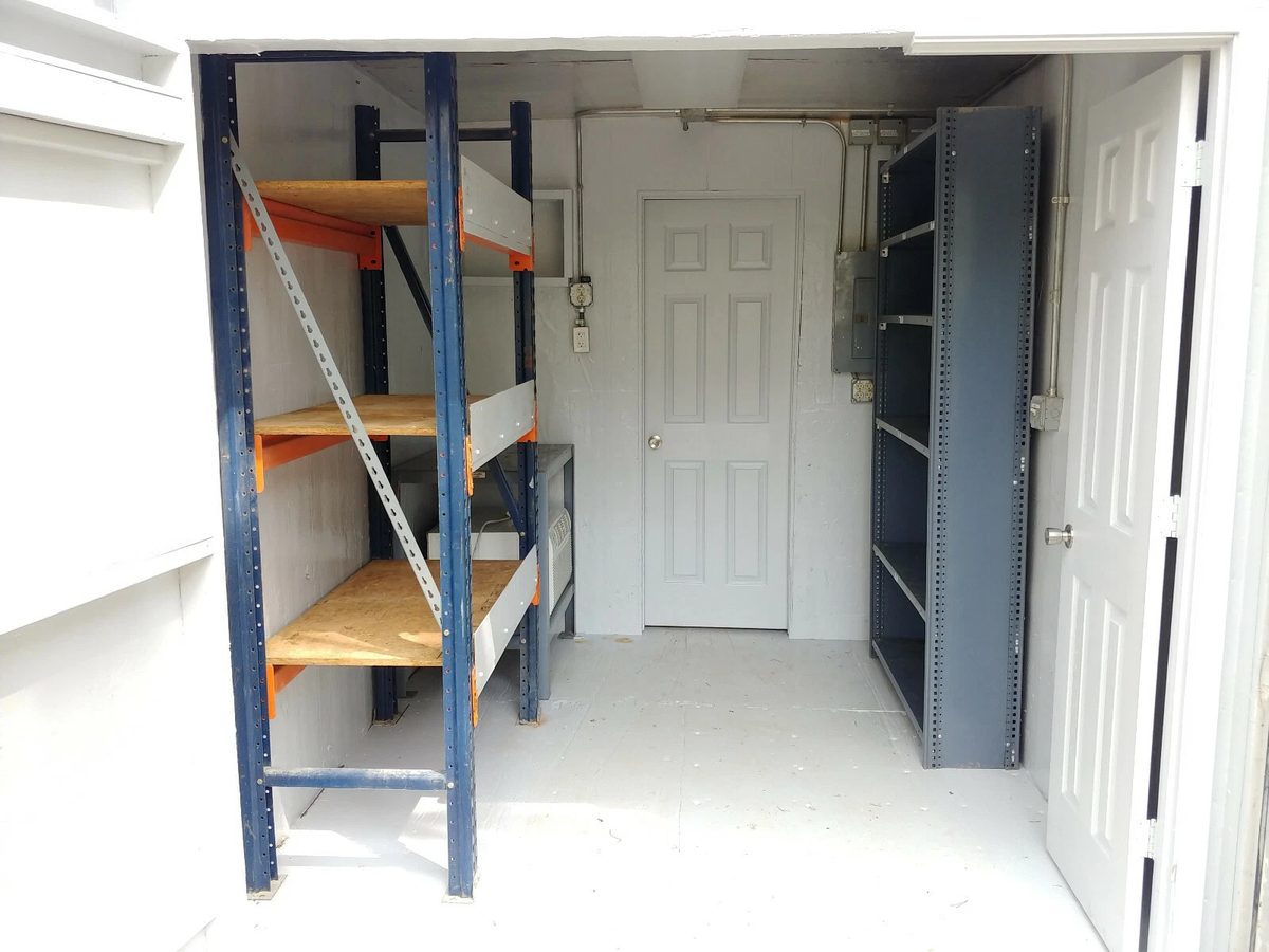 40ft High Cube Container Office – Storage Racking, Side Access – container storage interior with metal racking and connecting door