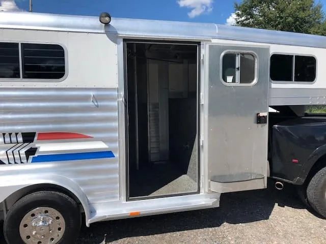 2004 4 Star 2 Horse Gooseneck Trailer – Slant Load, White – Open side entry door leading into the dressing room area of the trailer