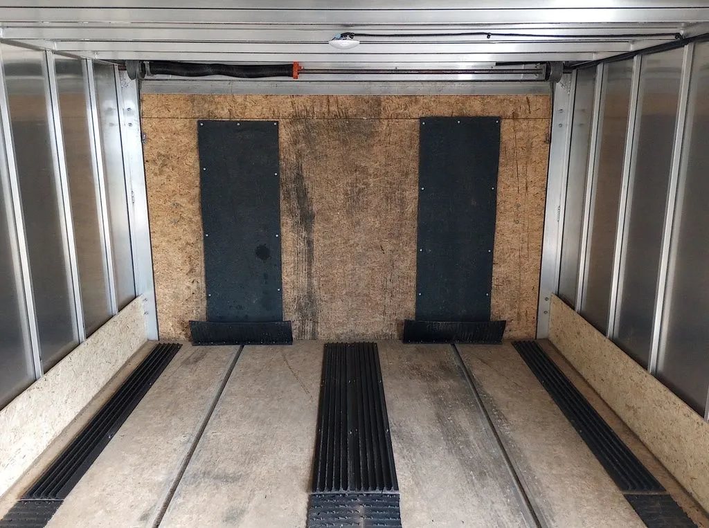 2022 Sno Pro Trailers Hybrid 2.0 – Charcoal Snowmobile Trailer – Interior view looking towards the rear ramp door with rubber floor guides