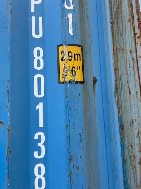 40ft High Cube Shipping Container – Used, Locking Doors – close-up of blue container with height label and rust