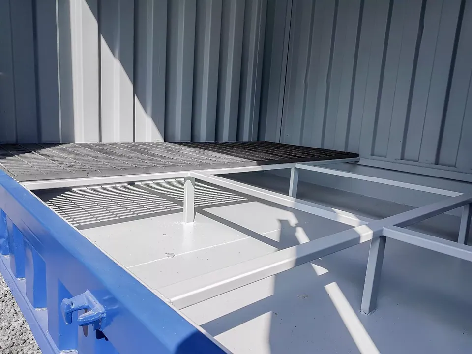 20ft Refurbished Bunded Container – Side Access Doors – Exposed bunded floor framework with partially installed metal grating