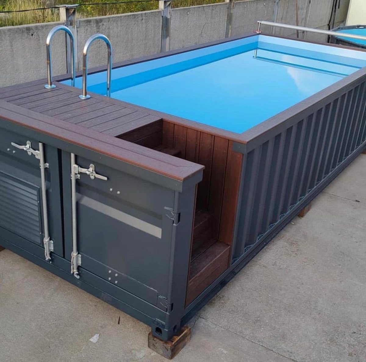 20ft Container Pool – Integrated Filtration and Access Steps – elevated exterior view of container pool with deck and ladder