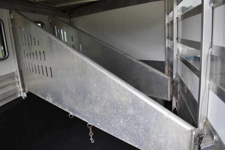 2012 CM 3 Horse Bumper Pull Trailer – Aluminum, Hayrack – Wide angle of multiple aluminum slanted partitions inside the horse trailer