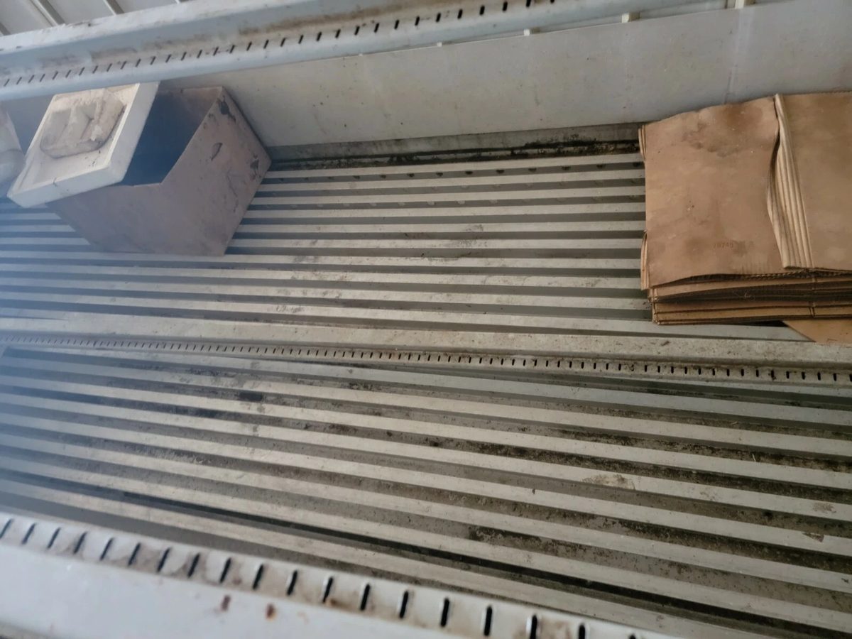 40ft As-Is Insulated Container – Electrical Connection – Dirty ribbed interior floor with cardboard and loose equipment