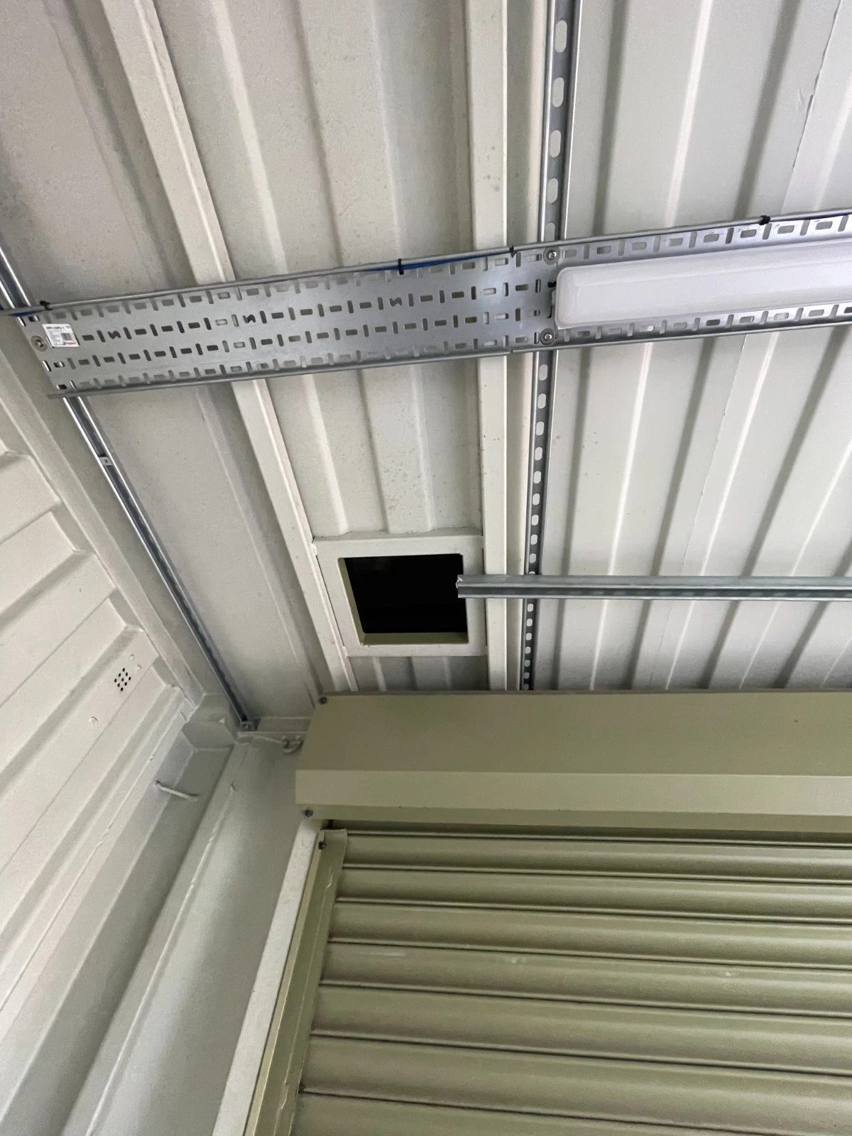 13ft Used Shipping Container – Lock Box Storage – Interior ceiling with light fixture and roller shutter door