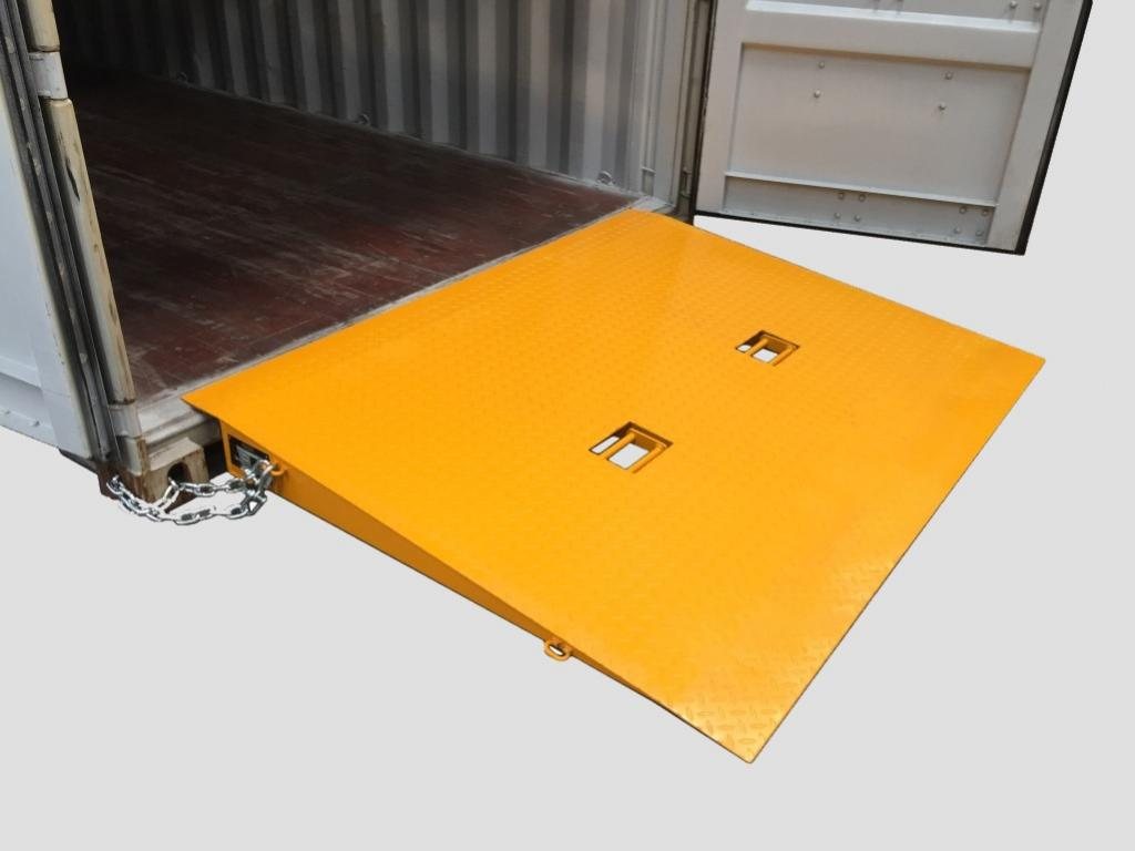 Shipping Container Loading Ramp – Removable Steel – Yellow steel container ramp with safety chains and integrated handle pockets for transport