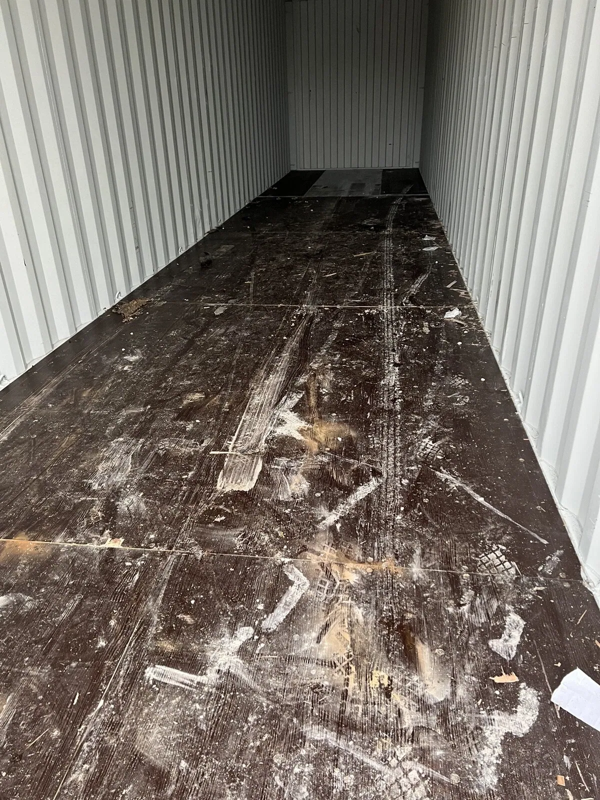 40ft High Cube Shipping Container – One-Trip, Double Doors – empty container interior with dirty wooden floor and corrugated walls