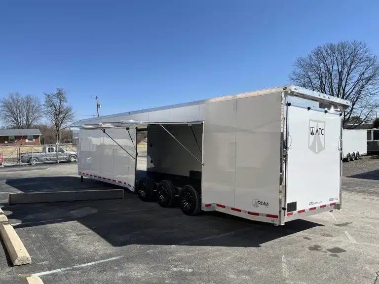 2026 ATC 44 ft Car Trailer – Aluminum Wheels – White enclosed car trailer with large side awning door open showing triple axles