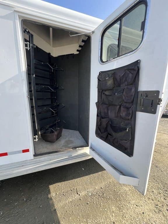 2020 Trails West Sierra 4 Horse Gooseneck – Comfort Package – Open dressing room door with black organizer pockets attached