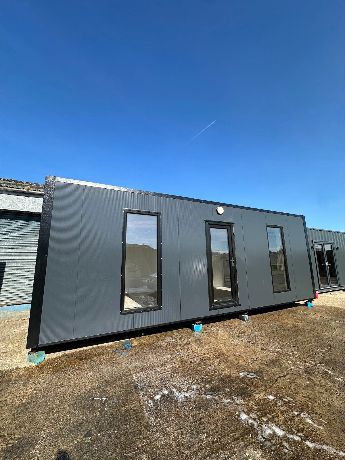 7.5m Modular Office – Kitchenette and Private Bathroom – grey modular office exterior with glazed door and tall windows