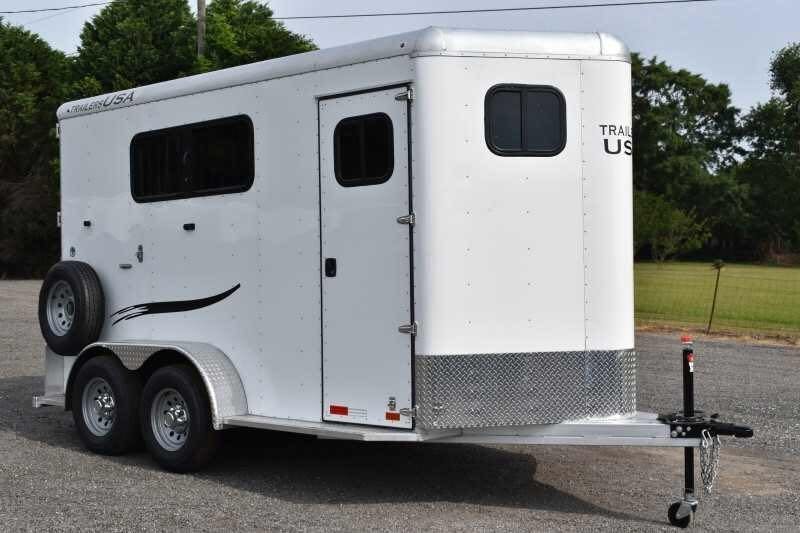 2019 Trailers USA 2 Horse Trailer – Aluminum, Dressing Room – Front three-quarter view of white horse trailer with entry door and spare tire