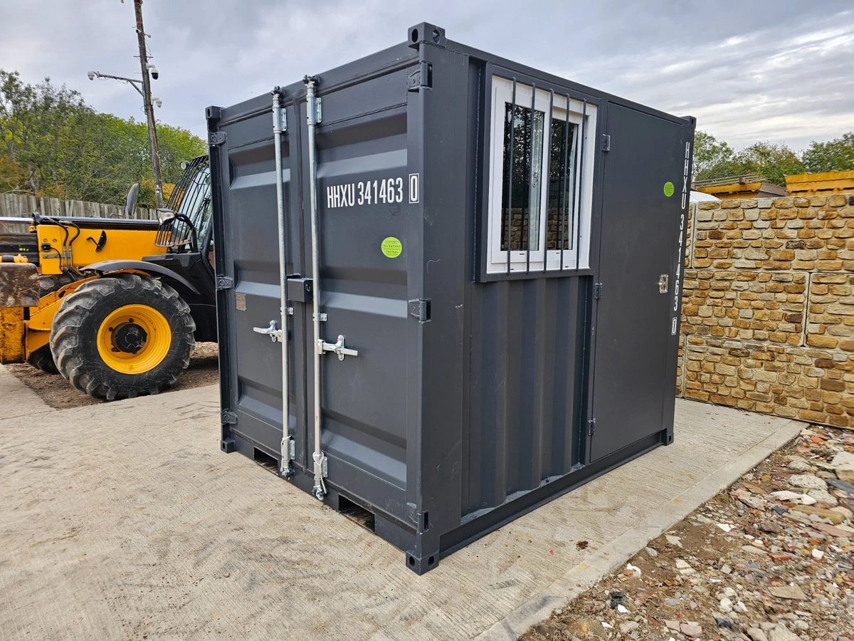 8ft New Shipping Container – Lockbox and Barred Windows – three-quarter exterior with closed cargo doors and barred side window