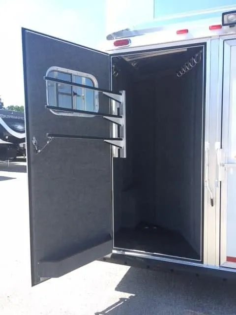 2018 Platinum Coach 3 Horse Bumper Pull – Rear Tack – Wide view of the open rear tack compartment door and internal hooks