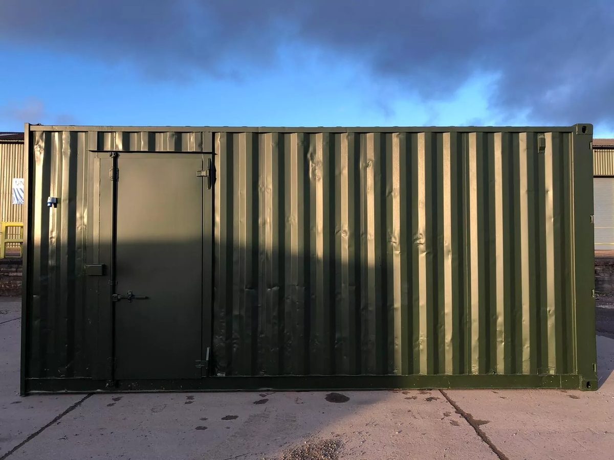 20ft High Cube Storage Container – Lighting and Shelving – side exterior of green container with closed personnel door