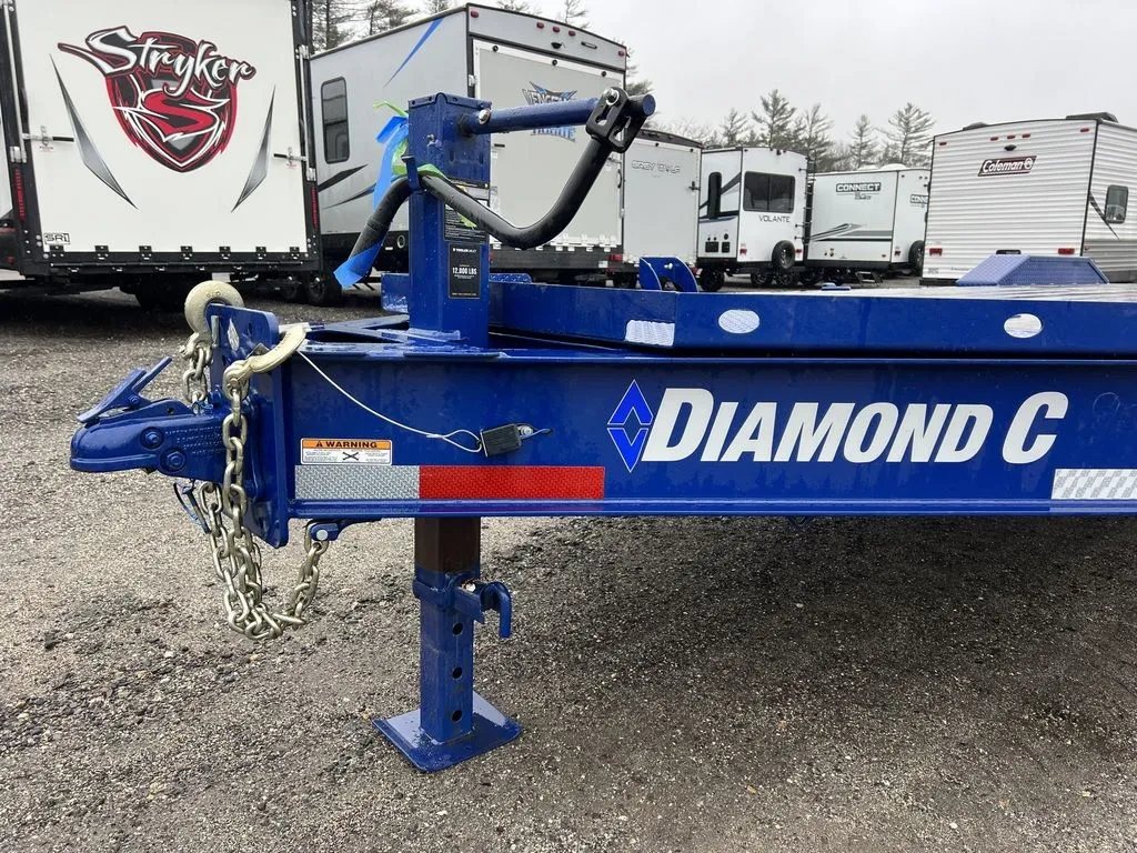 2022 Diamond C 24 ft Equipment Trailer – Max Ramps – Close up of the front hitch area, jack stand, and safety chains