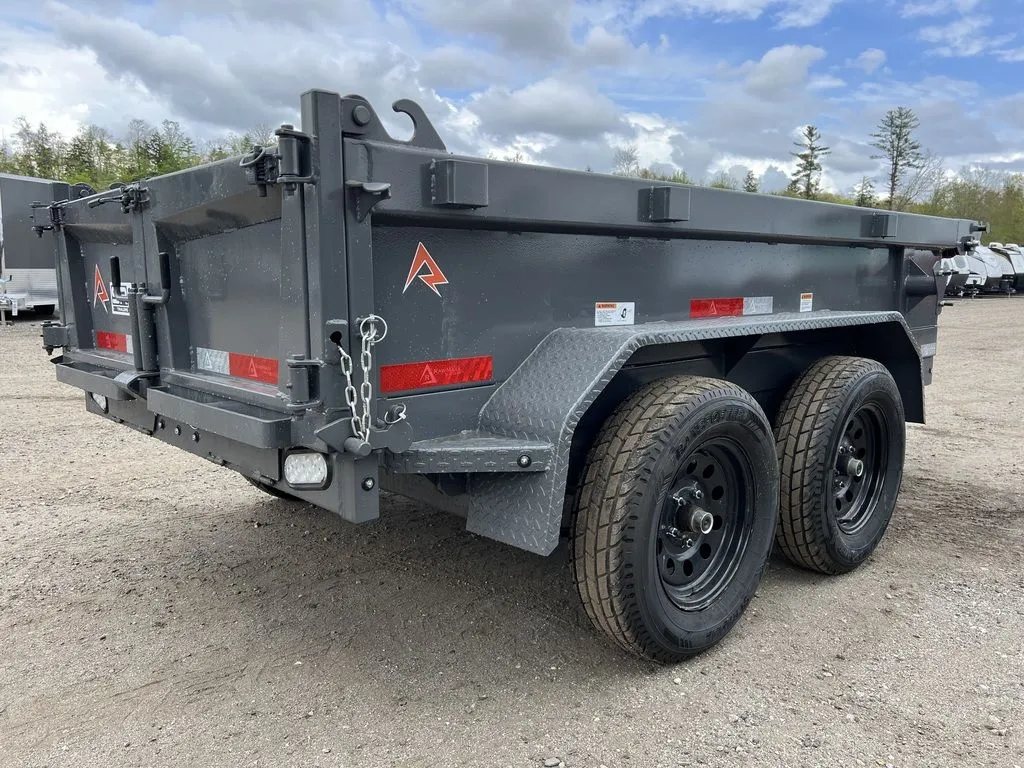 2024 RawMaxx 10 ft Dump Trailer – Shadow Grey – Rear three-quarter view from the passenger side showing the rear gate and lights