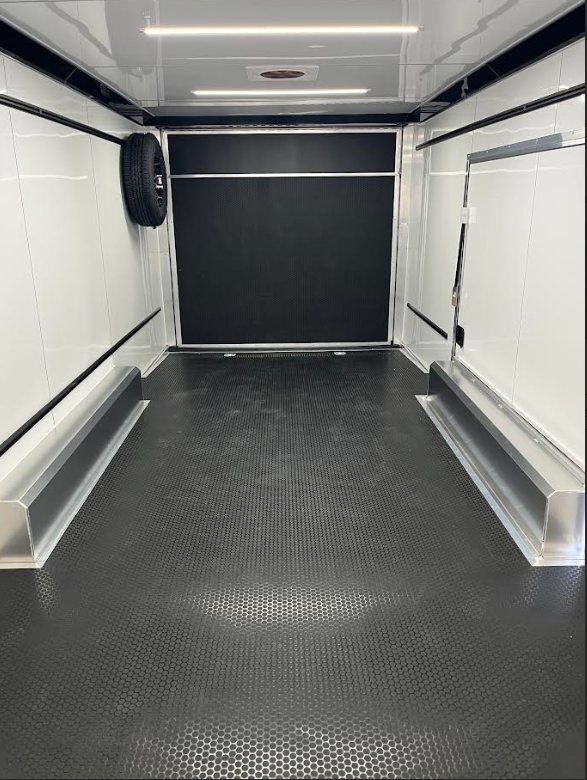 2026 ATC 24 ft ROM 550 Car Trailer – Silverfrost – Empty interior view looking towards the rear ramp door with black flooring