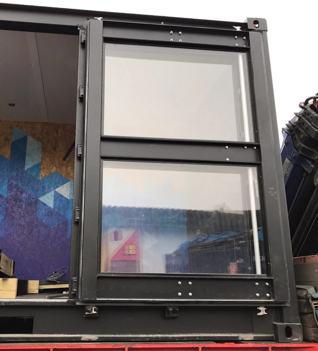 20ft Used Shipping Container – Integrated Glass Windows – close-up of container door fitted with two glass windows