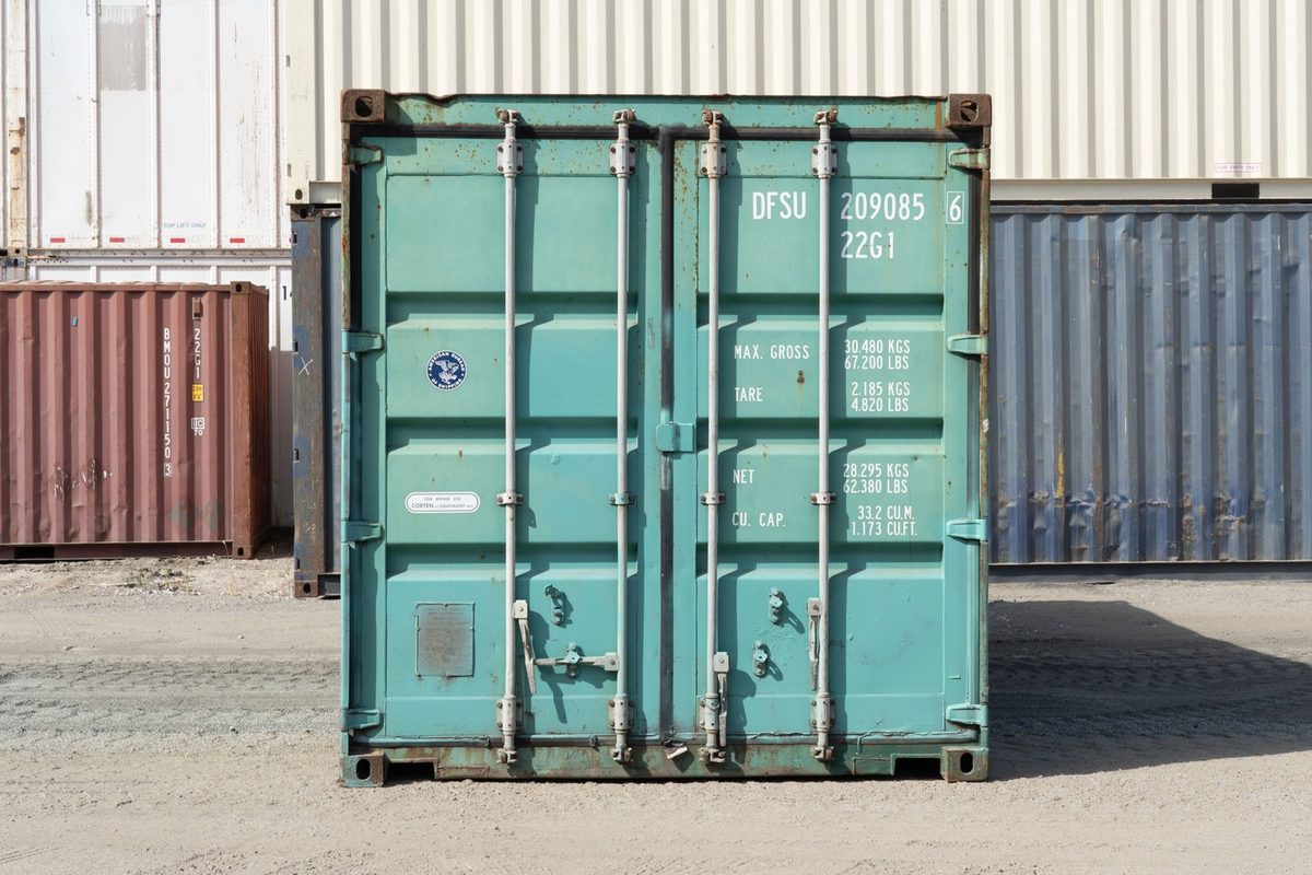 20ft Used Shipping Container – Storage-Class, Standard Height – straight-on view of weathered container with cargo doors closed