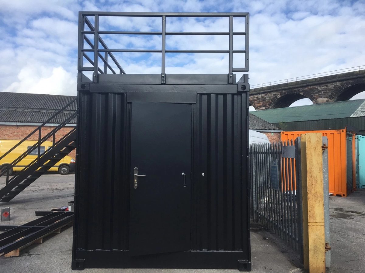20ft Converted Shipping Container – Serving Hatches and Roof Deck – black container entrance with rooftop railings and external stairs