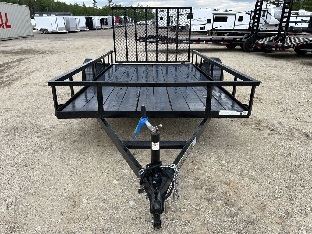 2024 Carry-On 12 ft Utility Trailer – Rear Ramp Gate – A front view showing the trailer tongue and the wood-planked deck
